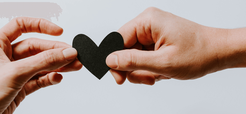 two hands hodling a heart
